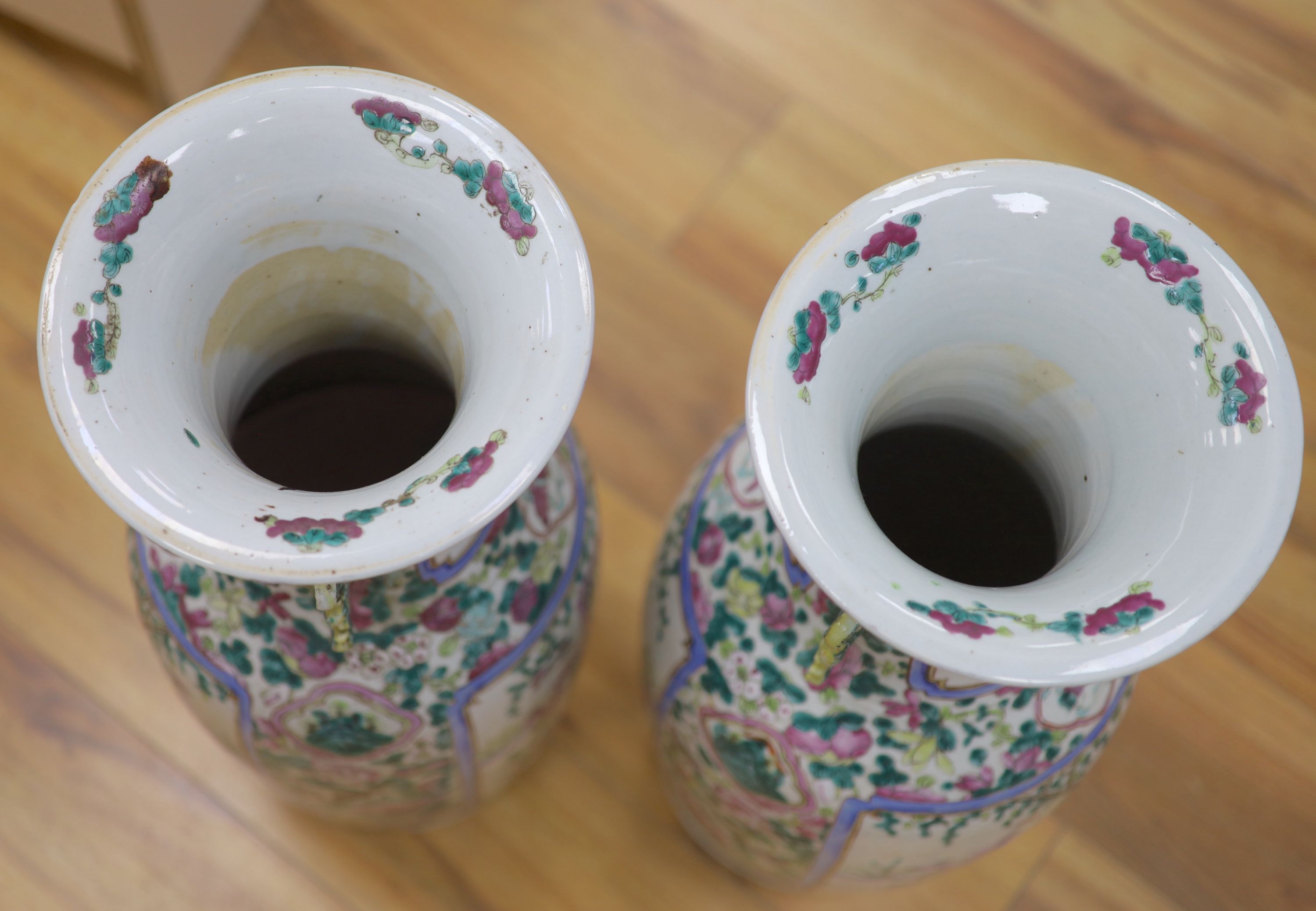 A pair of late 19th century Chinese large famille rose vases, height 61cm, one cracked